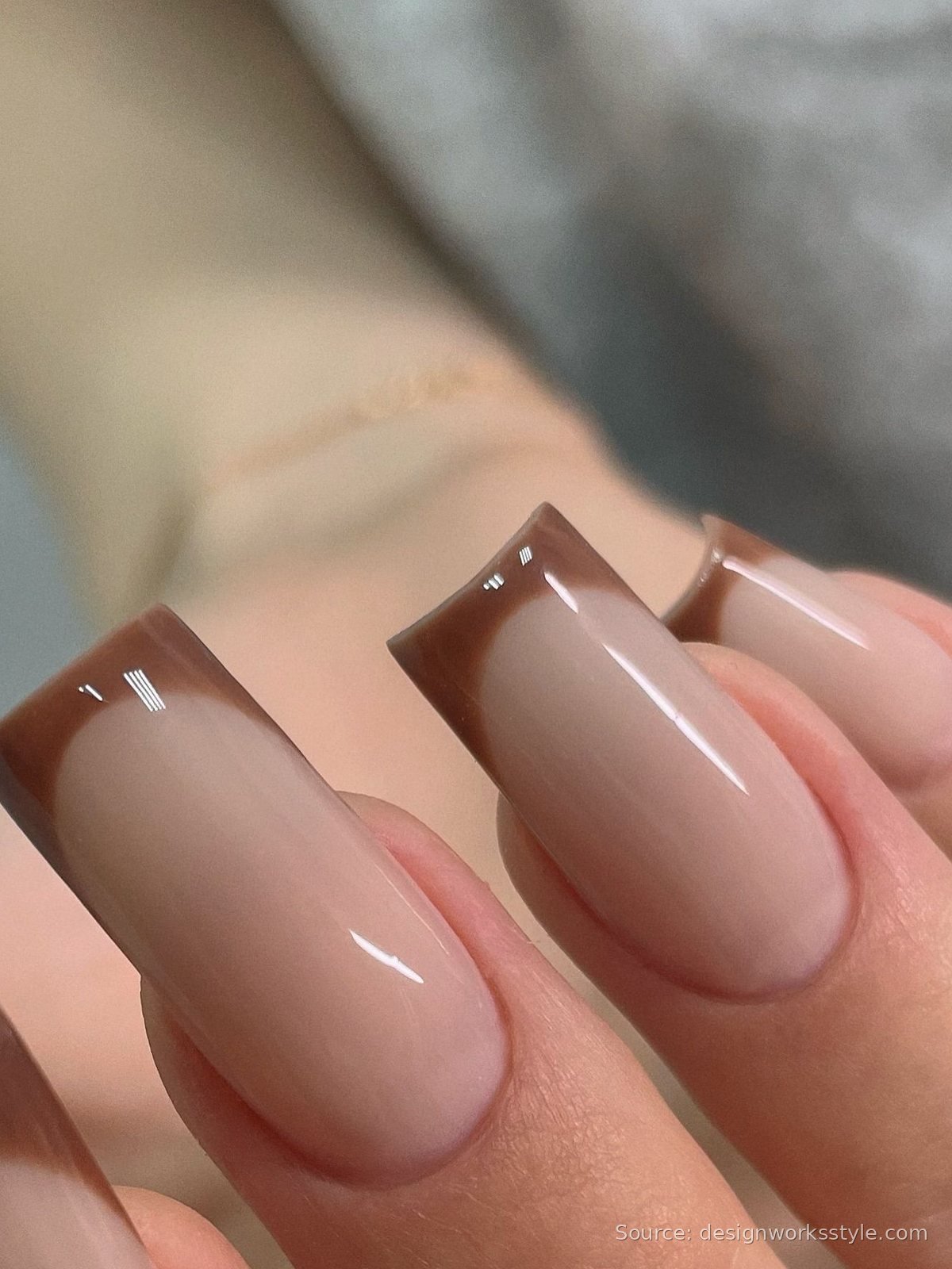 Brown French tip nails on nude long square nails