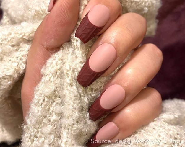 Burgundy cable knit French tip nails with matte finish