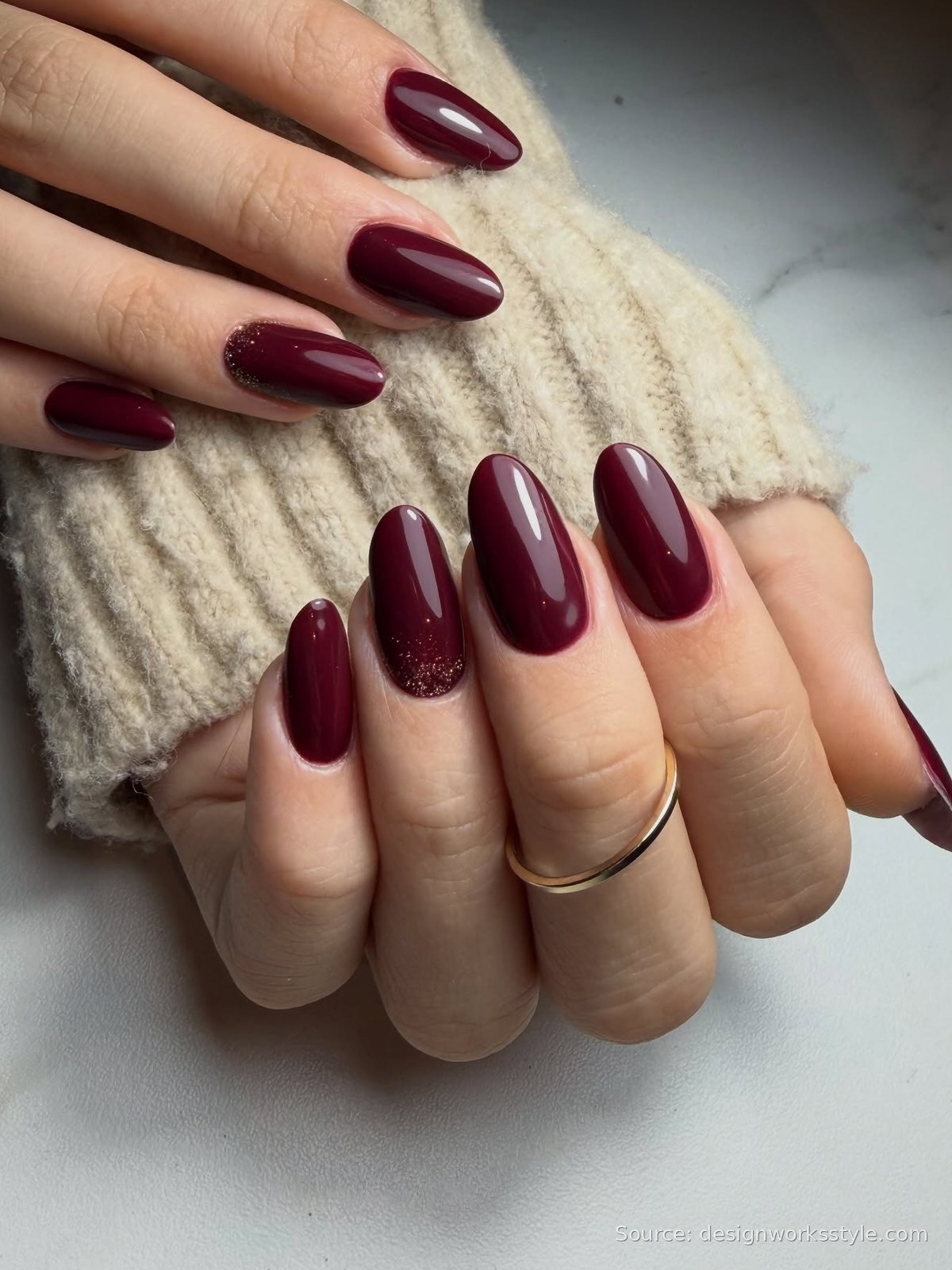 Deep burgundy nails with gold glitter accent nail for New Year's Eve