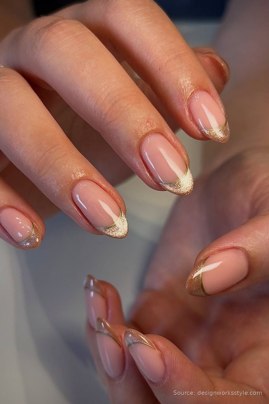 Champagne shimmer French tip nails on nude for New Year's Eve