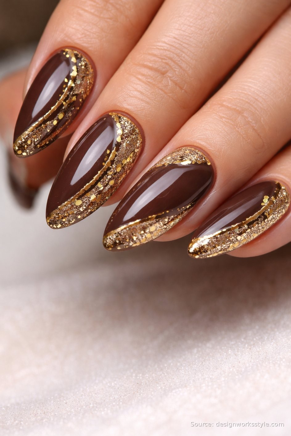Chocolate brown nails with diagonal gold glitter bands