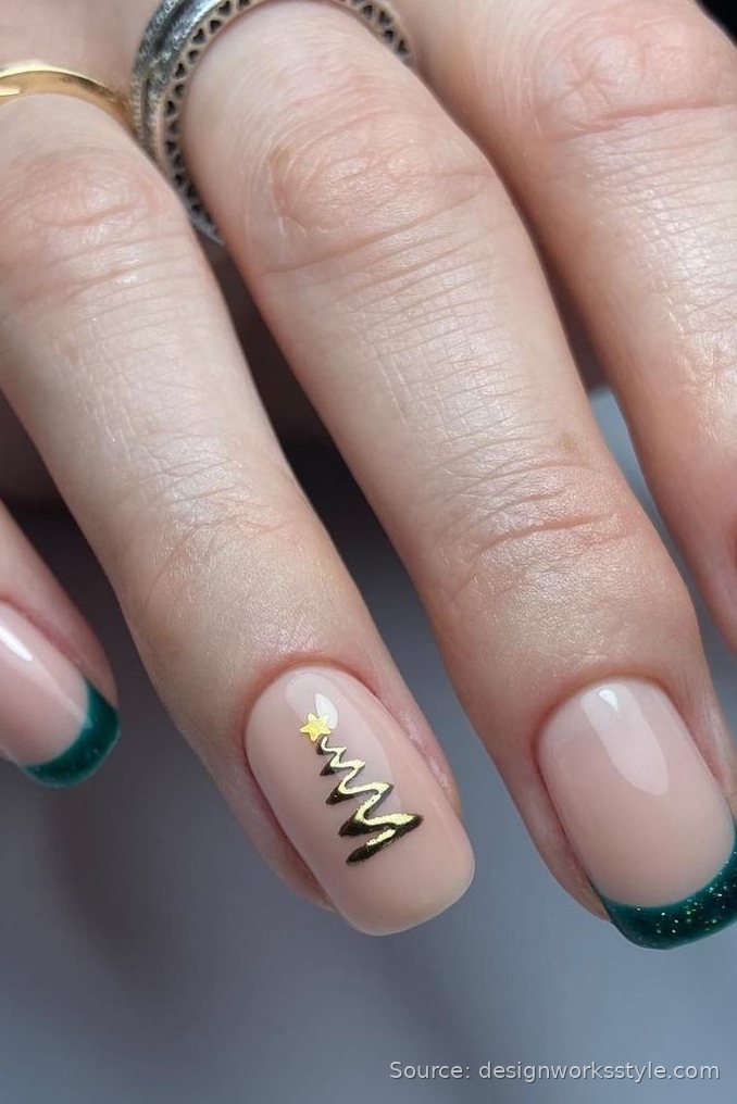 Nude nails with green glitter French tips and gold Christmas tree art