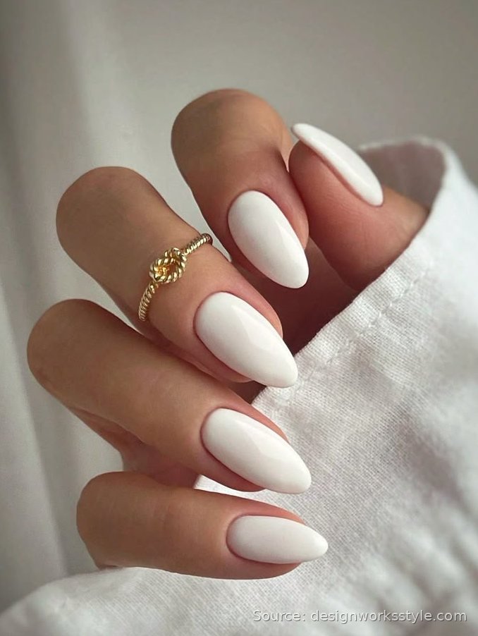 Clean white manicure on almond shaped nails