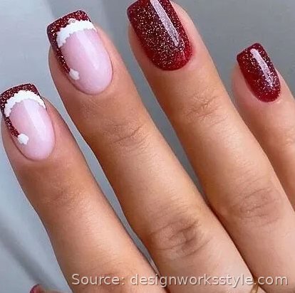 Cranberry glitter Christmas nails with Santa hat French tip accents
