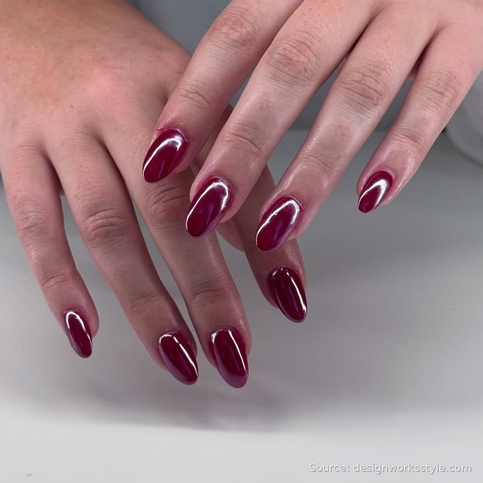Glossy cranberry red Thanksgiving nails on almond shaped nails