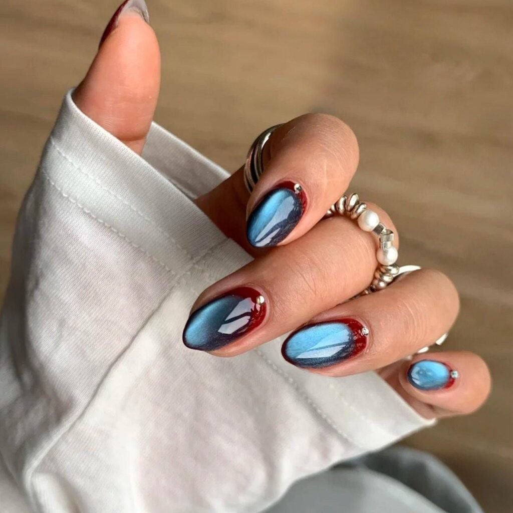 Blue and red dual shade magnetic cat eye nails with a glassy finish