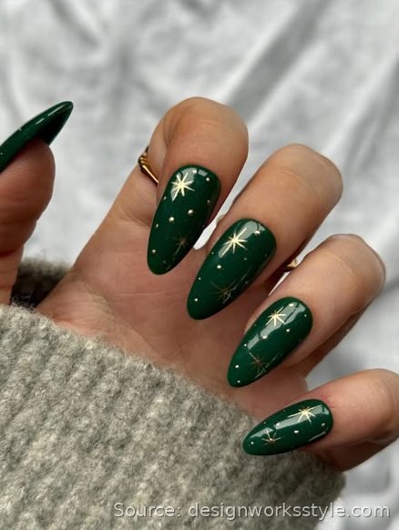 Emerald green nails with gold starburst accents for New Year's Eve