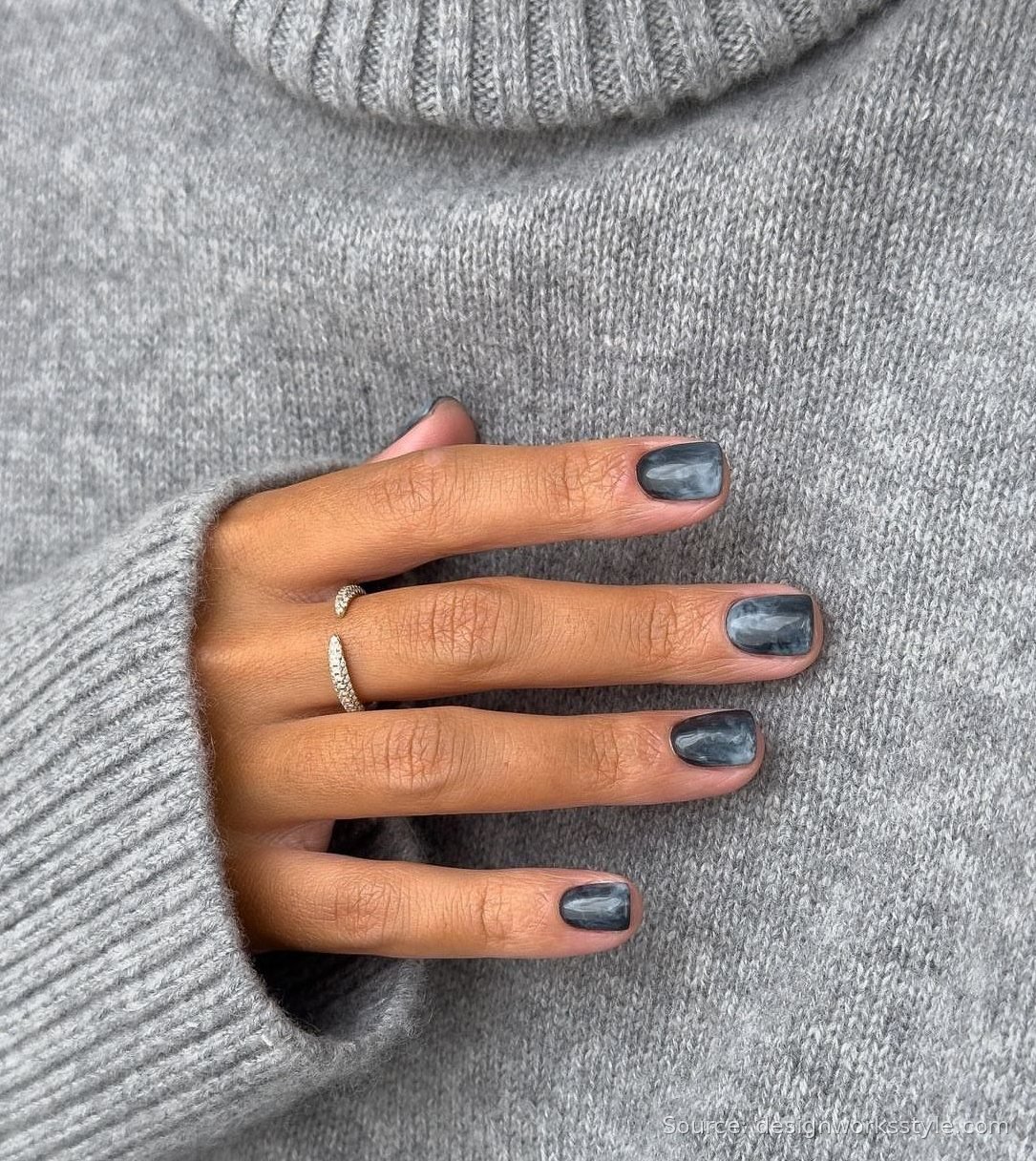 Smoky blue gray marbled nails with a cozy gray knit sweater