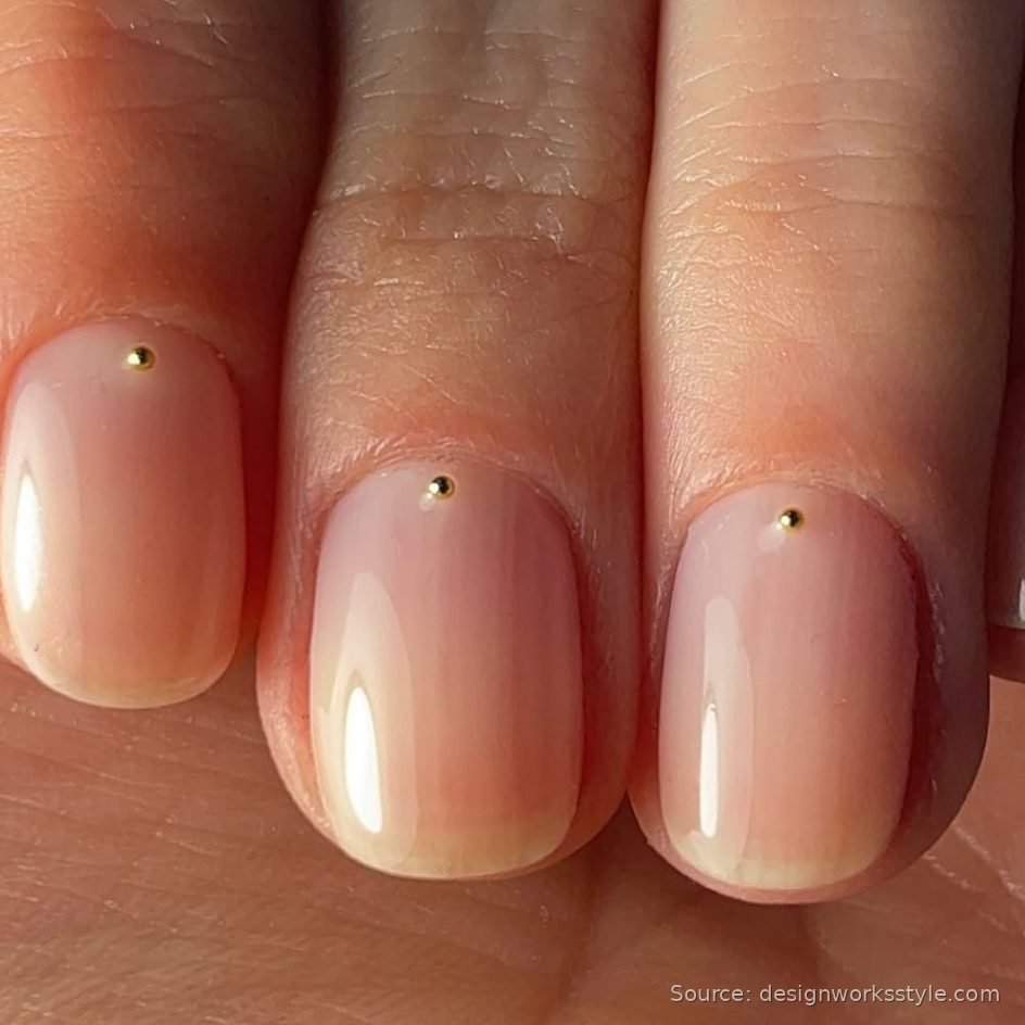 Gold cuticle dot nail art on nude nails