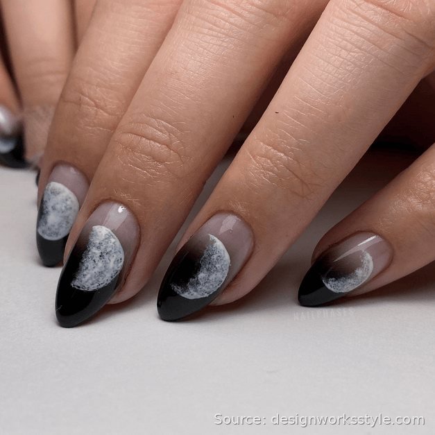 Moon phase nail art in silver on glossy black nails