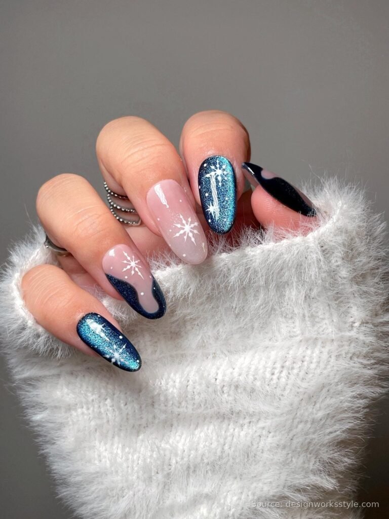 Icy blue shimmer winter nails with white snowflake art on almond shape