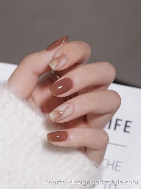 Latte marble nail art with milky coffee swirls on oval nails