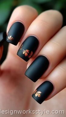 Matte black fall nails with gold leaf accents