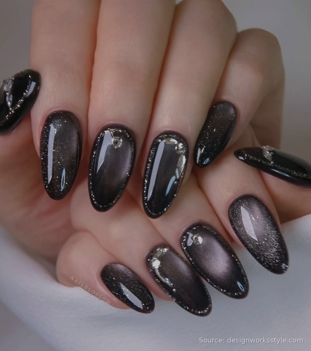 Black magnetic cat eye nails with silver shimmer and crystal accents