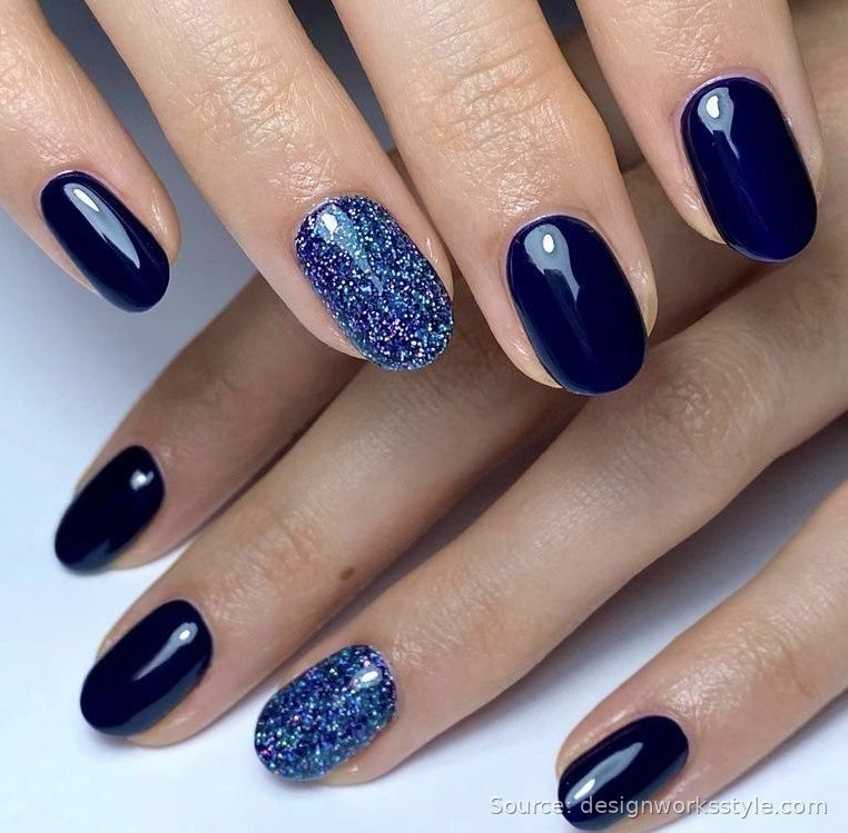 Midnight navy winter nails with blue glitter accent nails