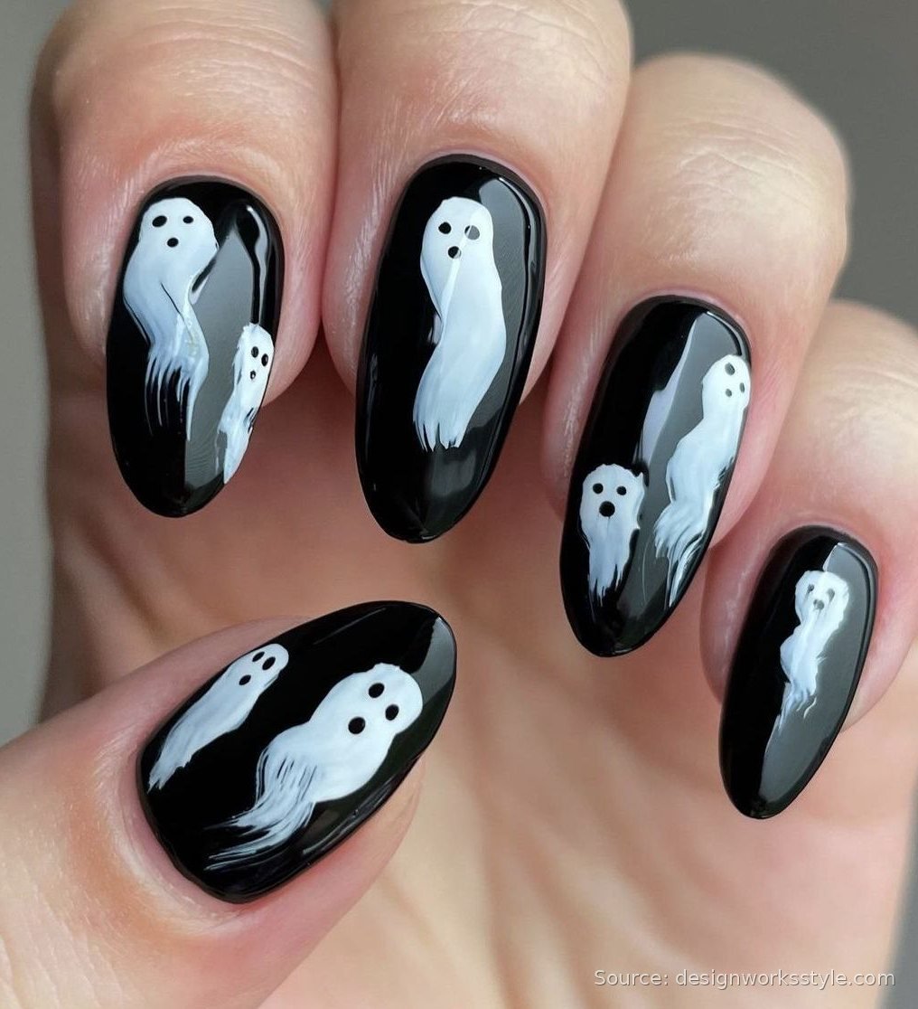 White ghost faces on glossy black nails
