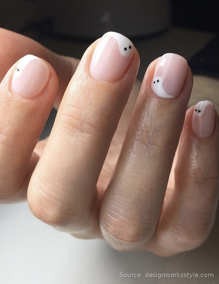 Minimalist tiny white ghost nail art on nude short nails