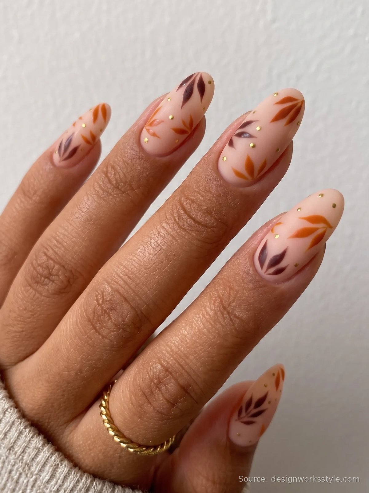 Nude fall nails with burnt orange and burgundy leaf art and gold dots