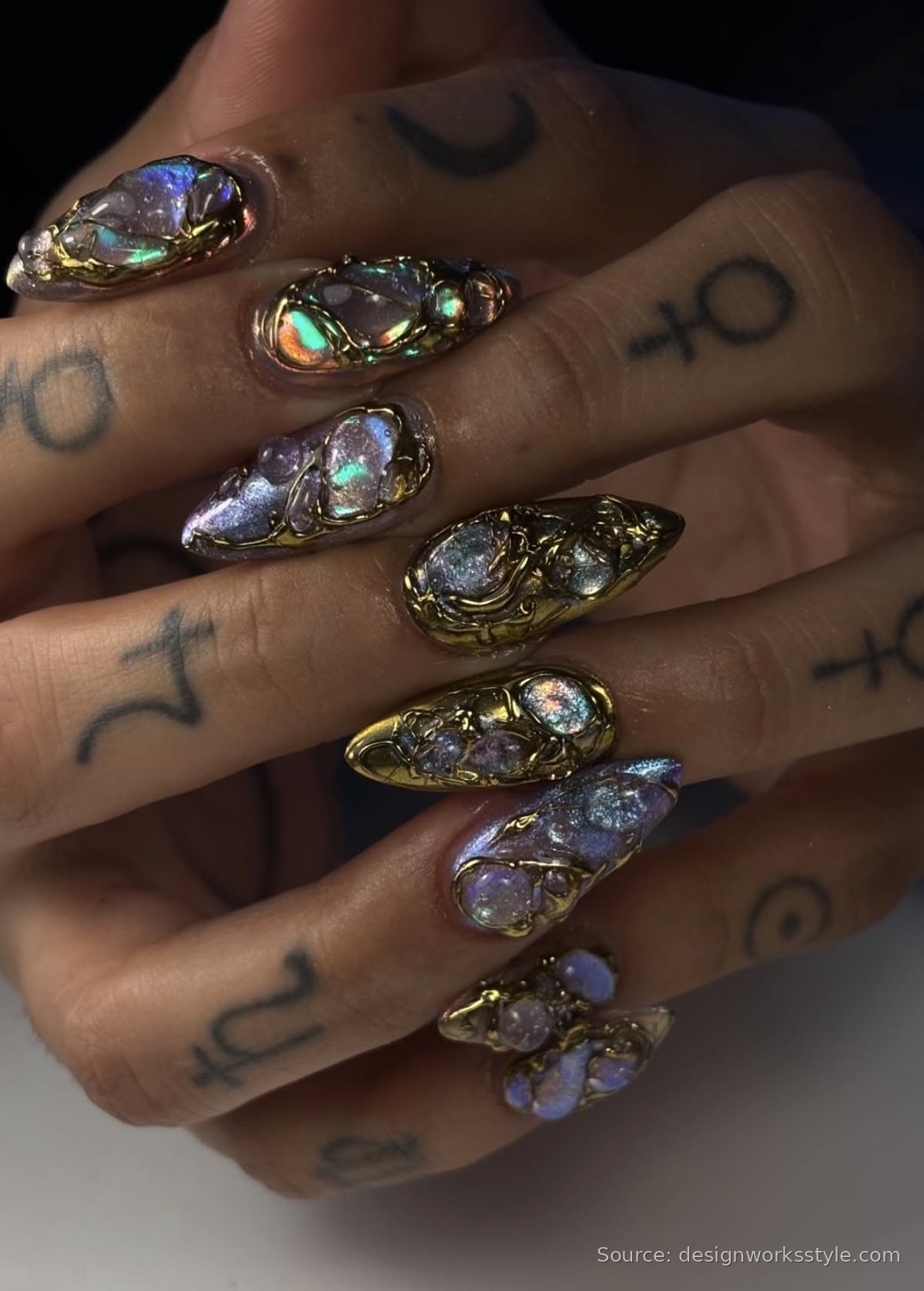 Opal birthstone nails with iridescent stones in gold frames