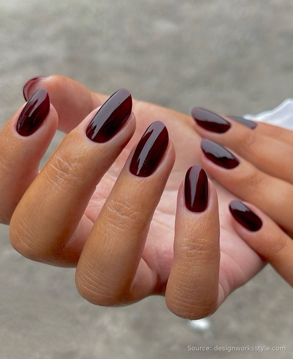 Dark oxblood red fall nails with glossy finish on almond shape