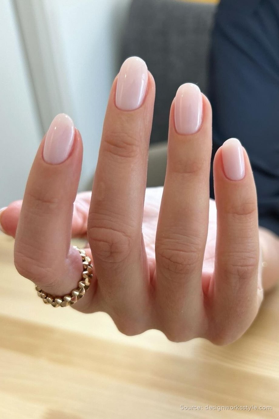 Elegant nude manicure perfectly matched to skin tone on almond nails