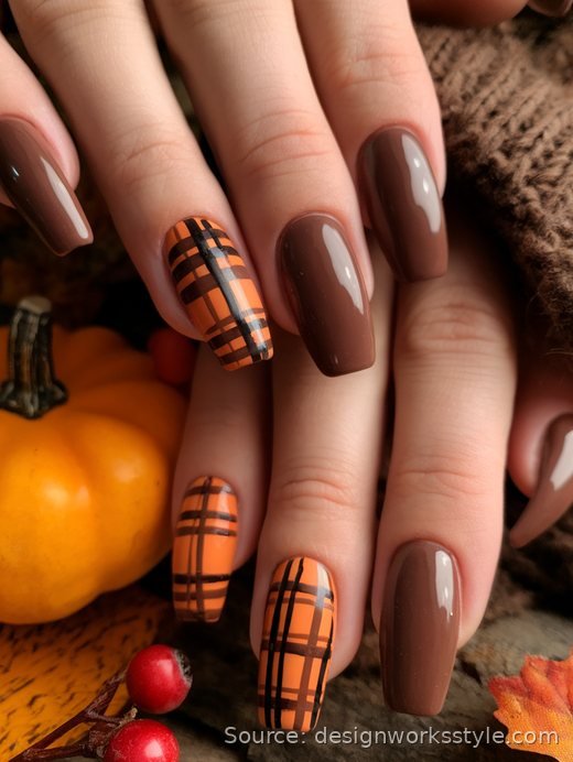 Thanksgiving plaid nails with orange and black plaid accent nails on brown