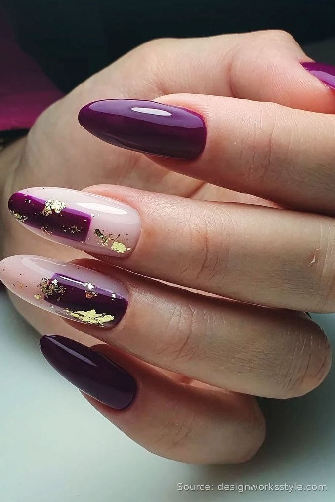 Plum winter nails with nude accent nails and gold foil flakes