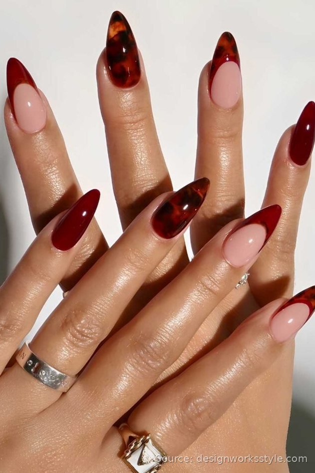 Dark red fall nails with tortoiseshell accent nails on almond shape