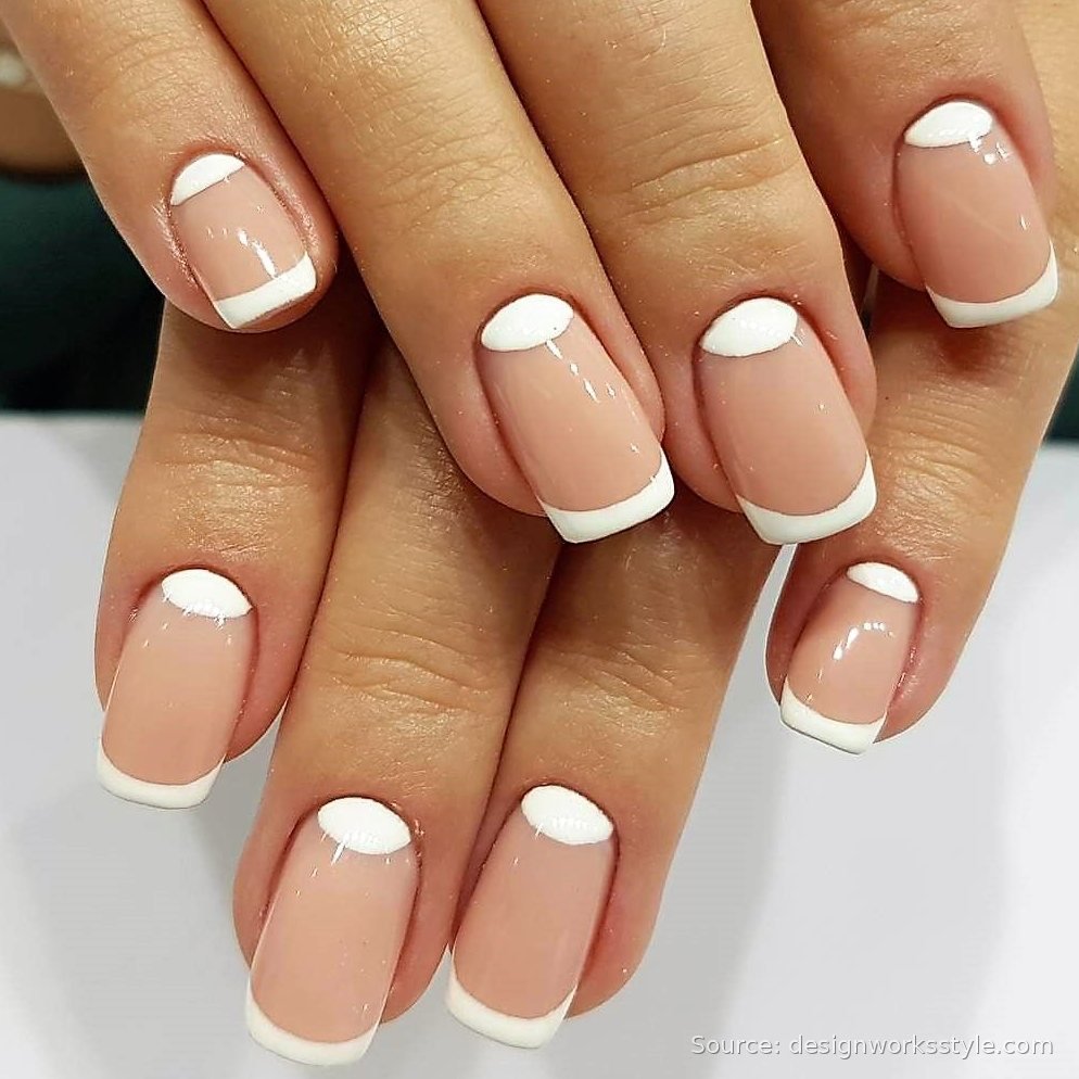 Reverse French half moon nails with white tips and lunula accents