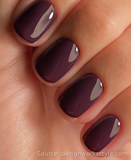 Rich deep plum solid color on short square nails