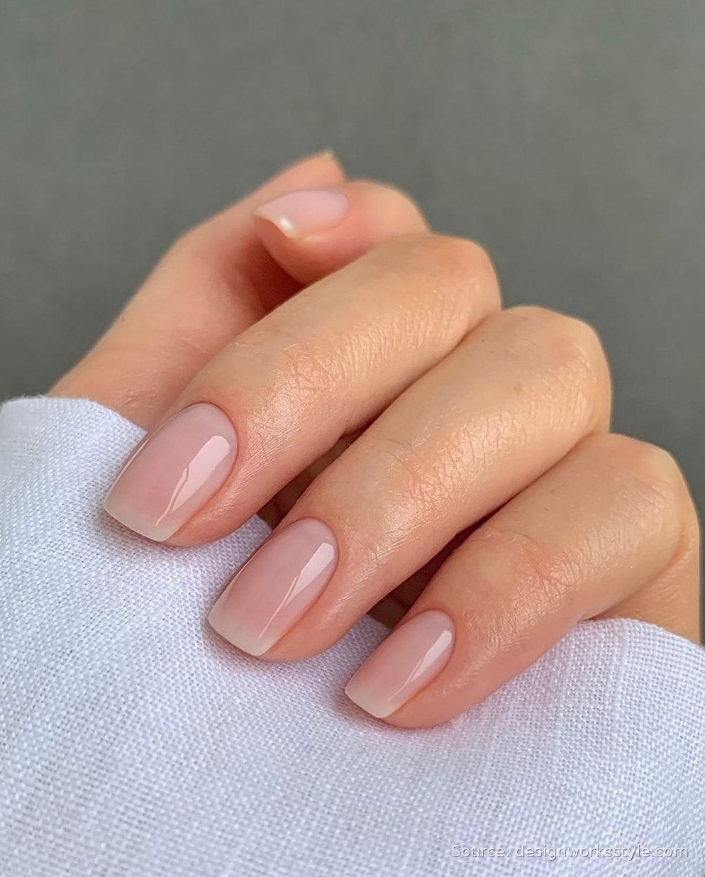 Sheer pink wash manicure on short square nails