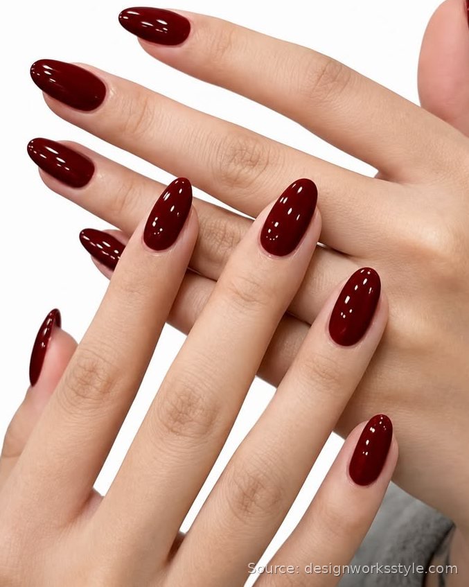 Solid oxblood red nails on almond shaped nails