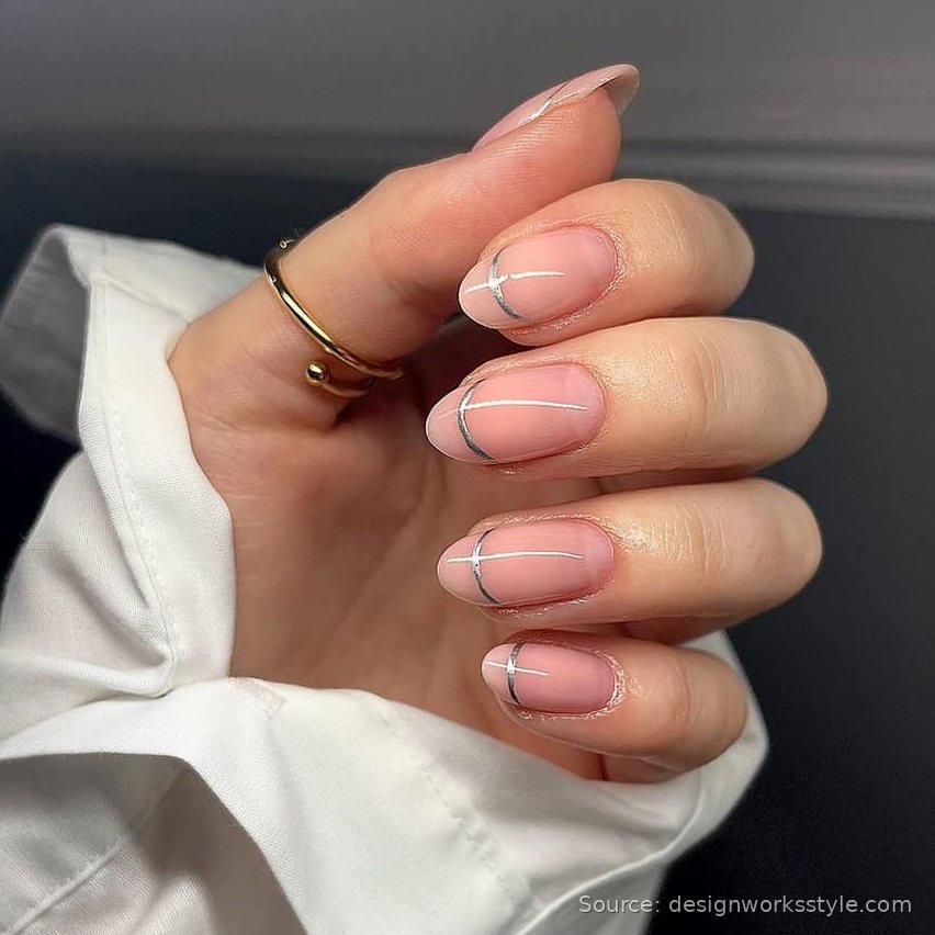 Thin silver line nail art on nude pink nails