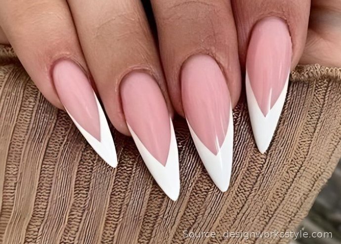 White V-shaped French tip nails on pink almond nails