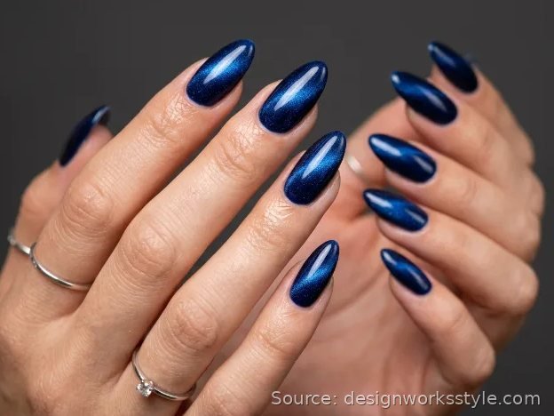 Velvet navy blue cat eye winter nails on almond shape