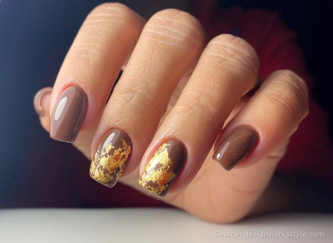 Warm brown Thanksgiving nails with gold leaf flake accents