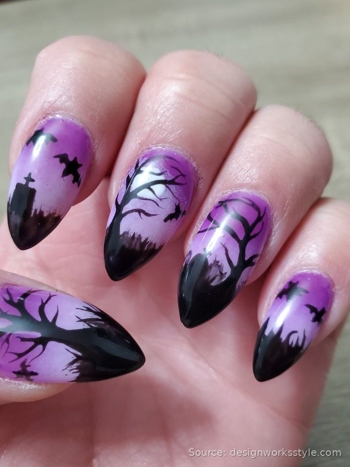 Witchy purple to black ombre Halloween nails with haunted tree and bat silhouettes