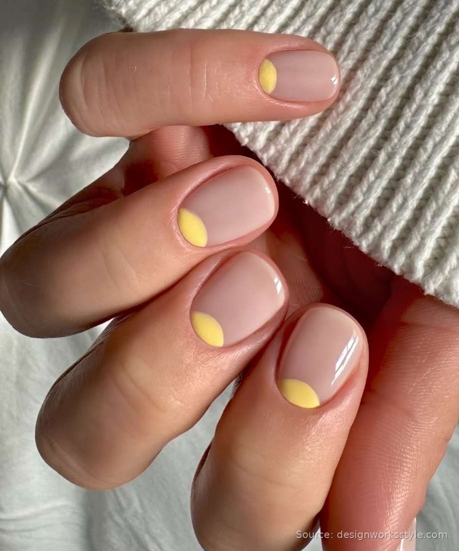 Yellow half moon manicure on neutral short nails